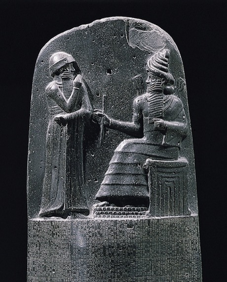 The upper relief of the Code of Hammurabi stele, showing King Hammurabi standing before Shamash, the Babylonian god of justice