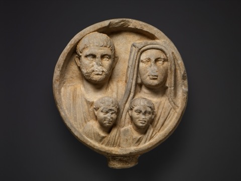 A carved Roman funerary relief depicting members of a burial collegium, the voluntary associations that pooled dues to guarantee each member a proper funeral